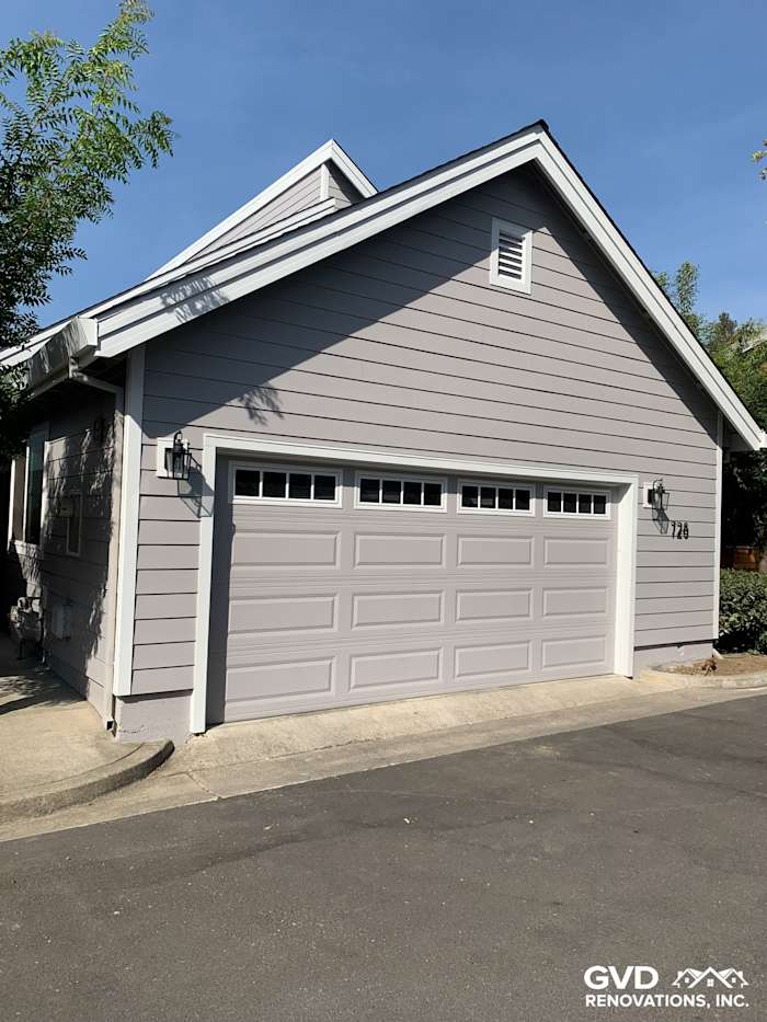 Freshly installed Pearl Gray James Hardie siding and Arctic White trim on Napa home exterior