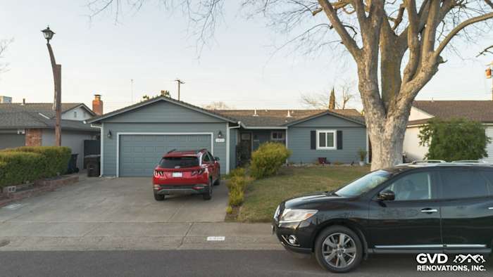Home exterior featuring Boothbay Blue James Hardie siding, painted eaves, and new gutters in Rancho Cordova