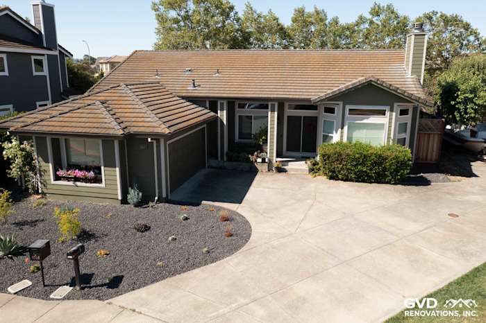 Petaluma home featuring Mountain Sage James Hardie siding, Cobble Stone trim, and a landscaped front yard