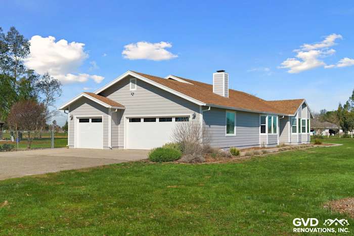 Galt home featuring Pearl Gray James Hardie Siding and Arctic White trim with Anlin Windows