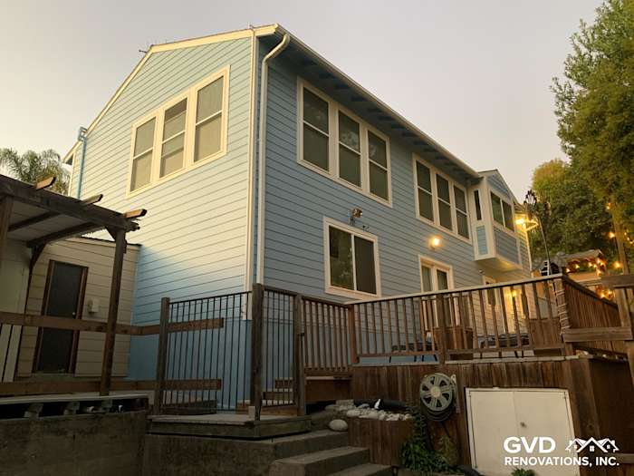 Light blue James Hardie siding and vinyl windows on a renovated home exterior in Oakland, CA