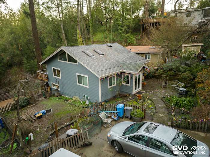 Modern home exterior featuring Boothbay Blue James Hardie siding and white trim in Forestville, CA