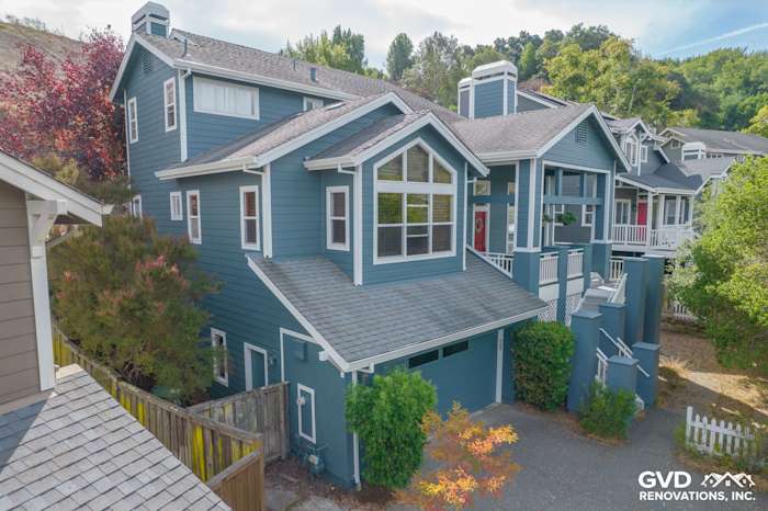 Corte Madera home featuring James Hardie Evening Blue siding with Arctic White trim and landscaped front yard