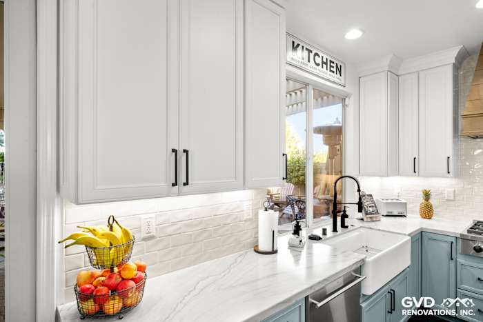 Bright kitchen remodel in Roseville featuring Fieldstone cabinetry, quartzite countertops, and a modern faucet