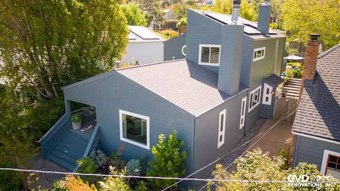 Corte Madera home featuring James Hardie Evening Blue siding and Arctic White trim with landscaped yard