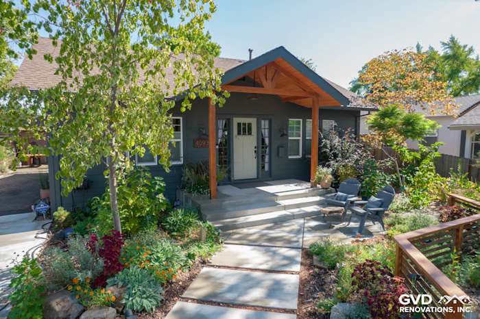 Home exterior featuring James Hardie Iron Gray Siding, modern porch, and landscaped walkway in Sacramento