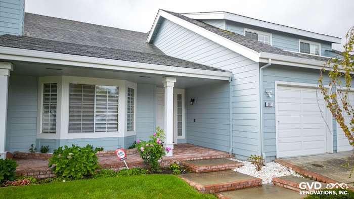 Foster City home exterior featuring James Hardie Cedarmill Siding, HardieTrim, and brick walkway with landscaping