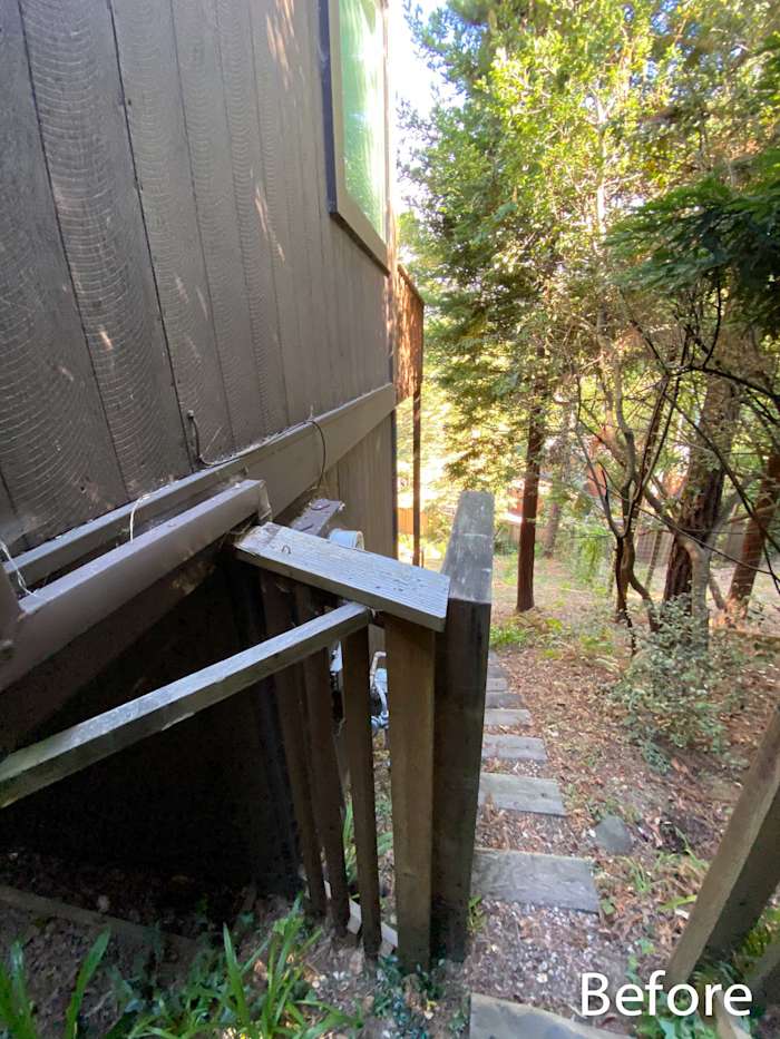 Before shot of a wooden staircase leading to a home exterior with a forested backdrop in Mill Valley