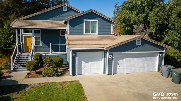 Blue James Hardie siding and Anlin windows on updated home exterior in Dixon, fresh deck and landscaping