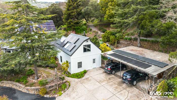 Modern home exterior in Sonoma with James Hardie Arctic White siding, Marvin windows, and solar panels