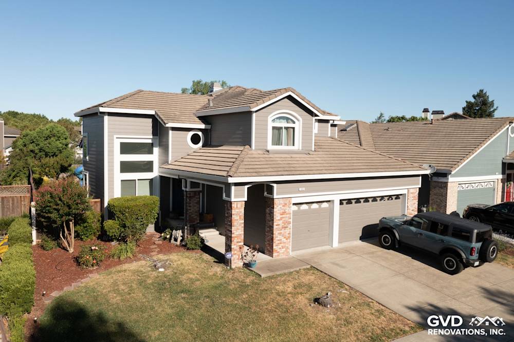 Two-story home in Petaluma with James Hardie Aged Pewter lap siding and new Alside Mezzo windows, showcasing a modern