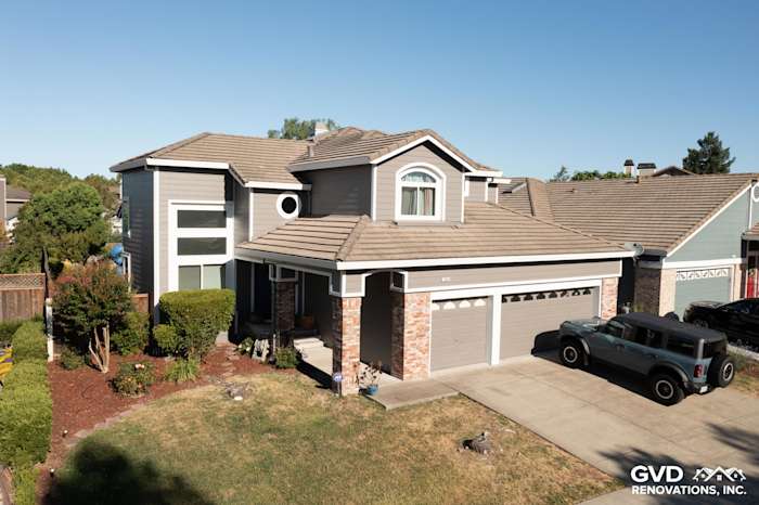 Two-story home in Petaluma with James Hardie Aged Pewter lap siding and new Alside Mezzo windows, showcasing a modern