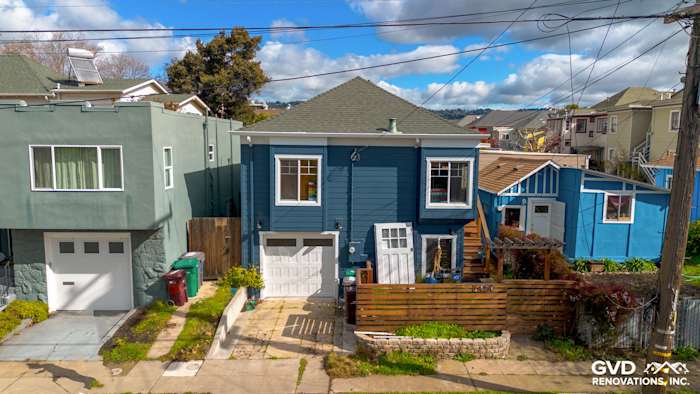 Oakland home exterior featuring new James Hardie Evening Blue siding and Arctic White trim