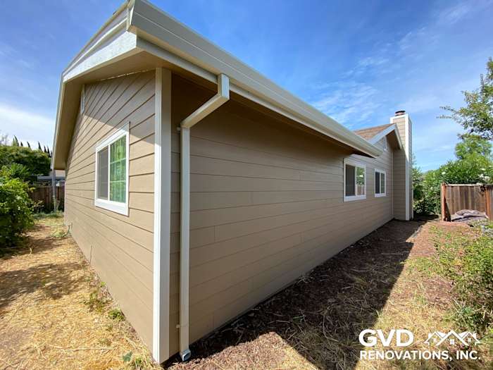 New James Hardie lap siding in khaki brown with Arctic white trim on home exterior in Fairfield, CA