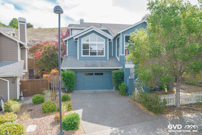 Home exterior in Corte Madera featuring James Hardie Evening Blue siding and Arctic White trim with landscaped yard