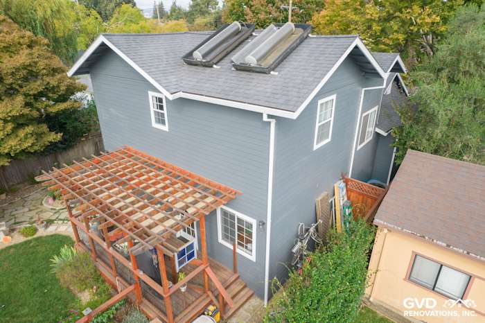 Rear view of a home in Napa featuring newly installed James Hardie lap siding and skylights