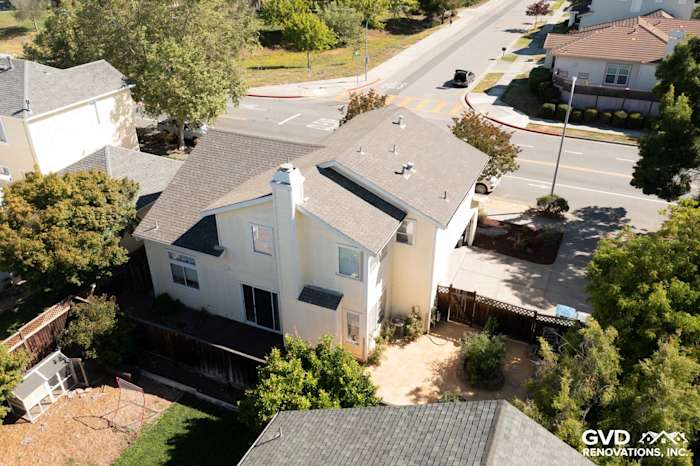 Home exterior in Petaluma featuring Prodigy insulated vinyl siding in cream color, surrounded by landscaping and street view