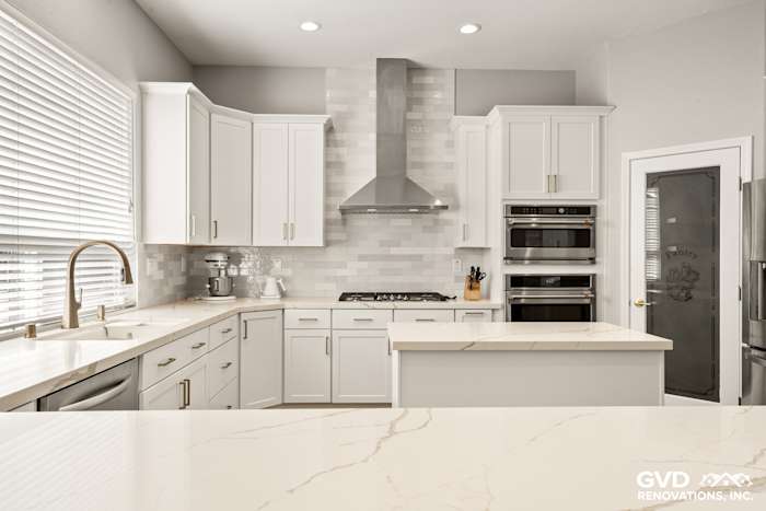 Modern kitchen in Roseville with Diamond cabinets, MSI countertops, and a sleek backsplash