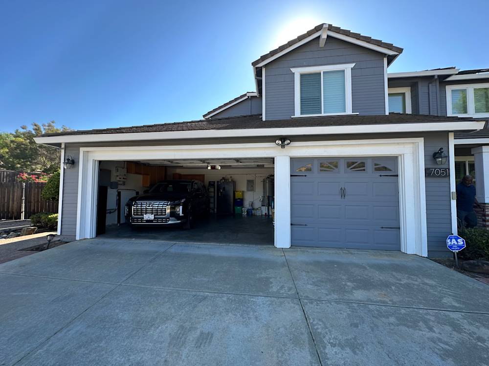 Contemporary gray garage in Sacramento with a concrete driveway and modern architecture