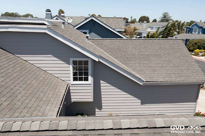 Pearl Gray James Hardie Plank Lap Siding with Arctic White HardieTrim on residential home in Foster City