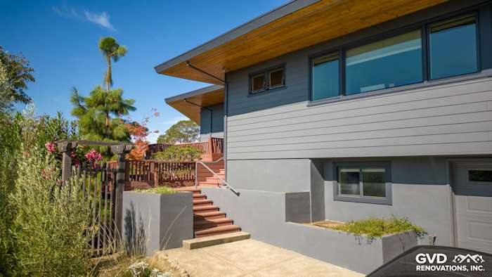 Modern home exterior featuring Night Gray James Hardie plank lap siding and wood accents in San Rafael, CA