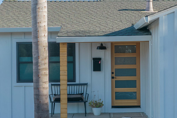Modern home exterior with Arctic White James Hardie vertical siding and trim in Concord, CA