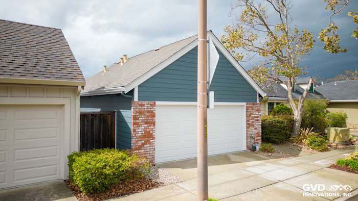 Evening Blue James Hardie siding with Arctic White trim on residential home in Alameda, CA