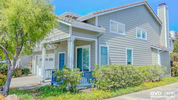 Home exterior featuring James Hardie Monterey Taupe siding, Arctic White trim, and Anlin windows in Richmond, CA