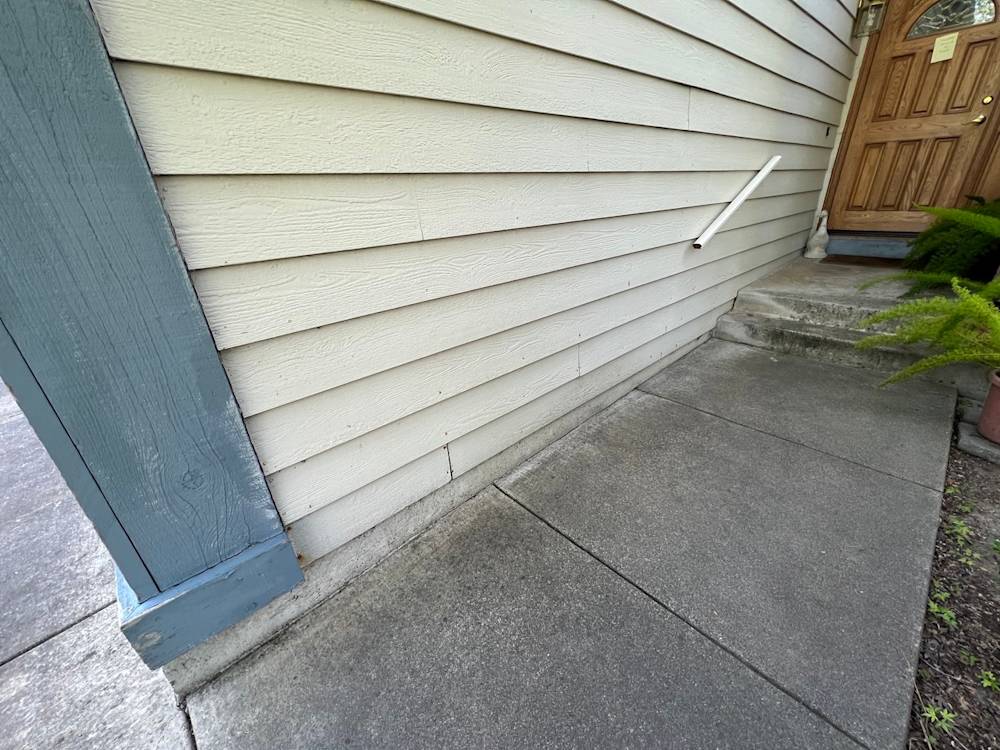 Weathered concrete walkway and siding at GVD Renovations project in Sacramento