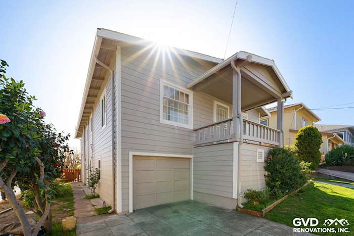 Pearl Gray James Hardie siding with Arctic White trim on a home exterior in Oakland