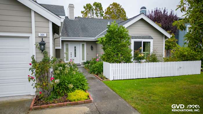 Foster City home with Monterey Taupe James Hardie siding, Arctic White trim, and new Milgard vinyl windows
