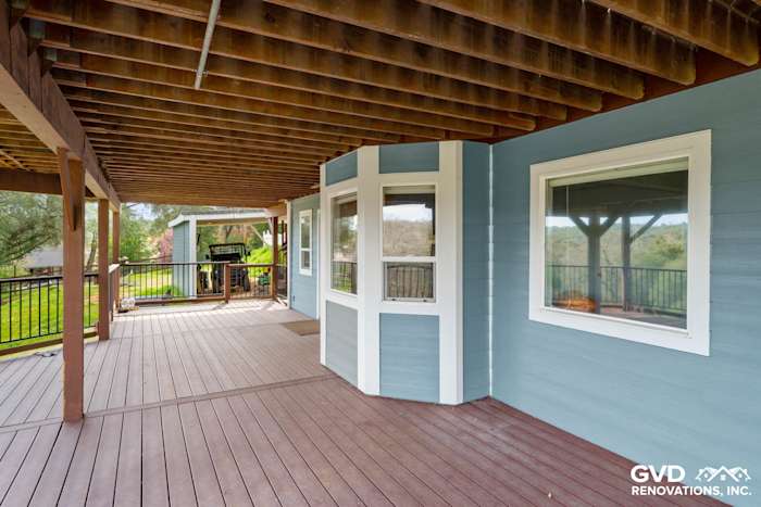 New James Hardie Siding installed on a home exterior, featuring a blue hue and large windows in Shingle Springs