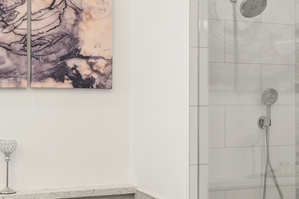 Luxurious bathroom with walk-in shower, freestanding tub, and elegant tile design in Cameron Park