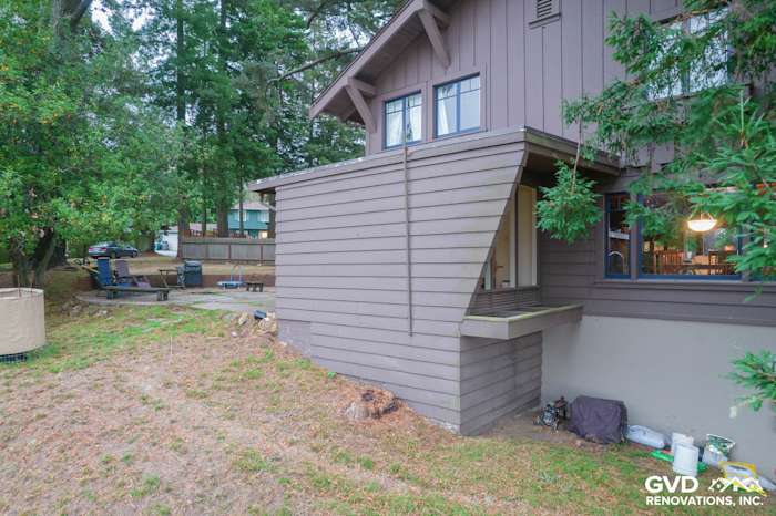 Home exterior featuring James Hardie Lap and Batten Siding in Timber Bark color with Anlin Windows