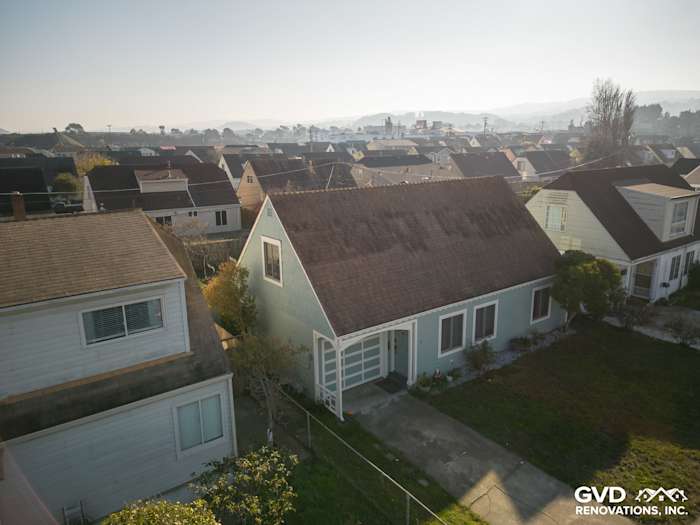 Elevated view of a home with newly installed James Hardie Artisan Lap Siding in light blue