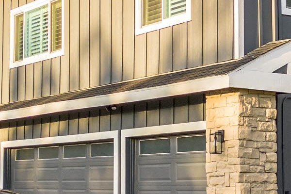 Dublin, CA home featuring newly installed Night Gray James Hardie siding with Arctic White trim and stone accents
