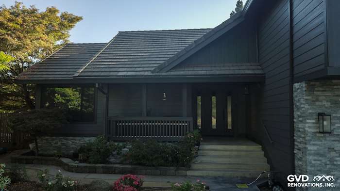 Sleek Sacramento home exterior featuring Night Gray HardiePlank siding and Iron Gray trim with stone accents