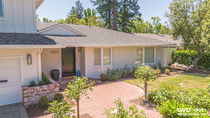 Stylish home exterior in Menlo Park with James Hardie siding, brick walkway, and landscaped garden