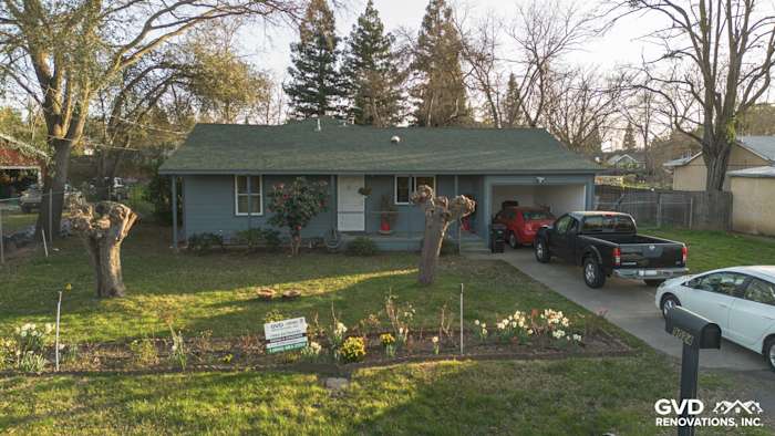 Home exterior with newly installed Boothbay Blue James Hardie siding and Anlin windows in Orangevale, CA