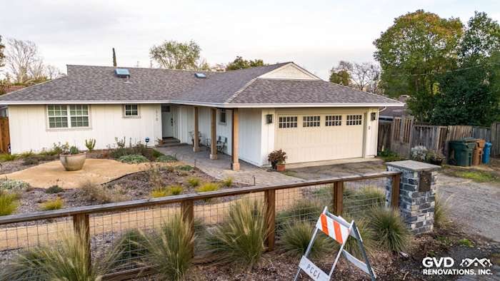 Modern home exterior in Pleasant Hill, featuring James HardiePanel Vertical Siding in Arctic White and a landscaped yard