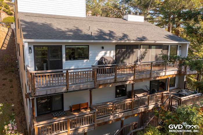 Two-story home exterior showcasing new Arctic White James Hardie siding and trim in Novato, CA