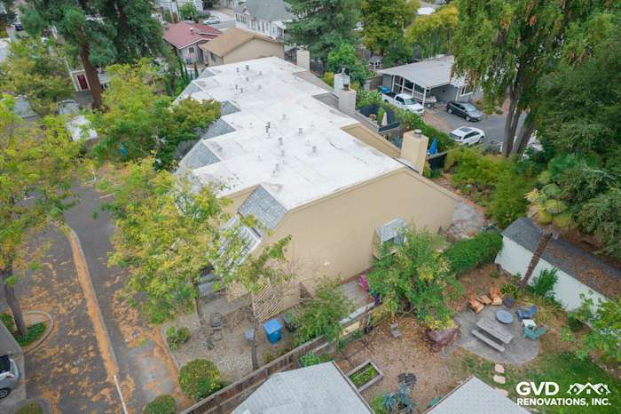 Aerial view of a remodeled quadplex featuring James Hardie siding in warm beige tones surrounded by greenery in Santa Rosa