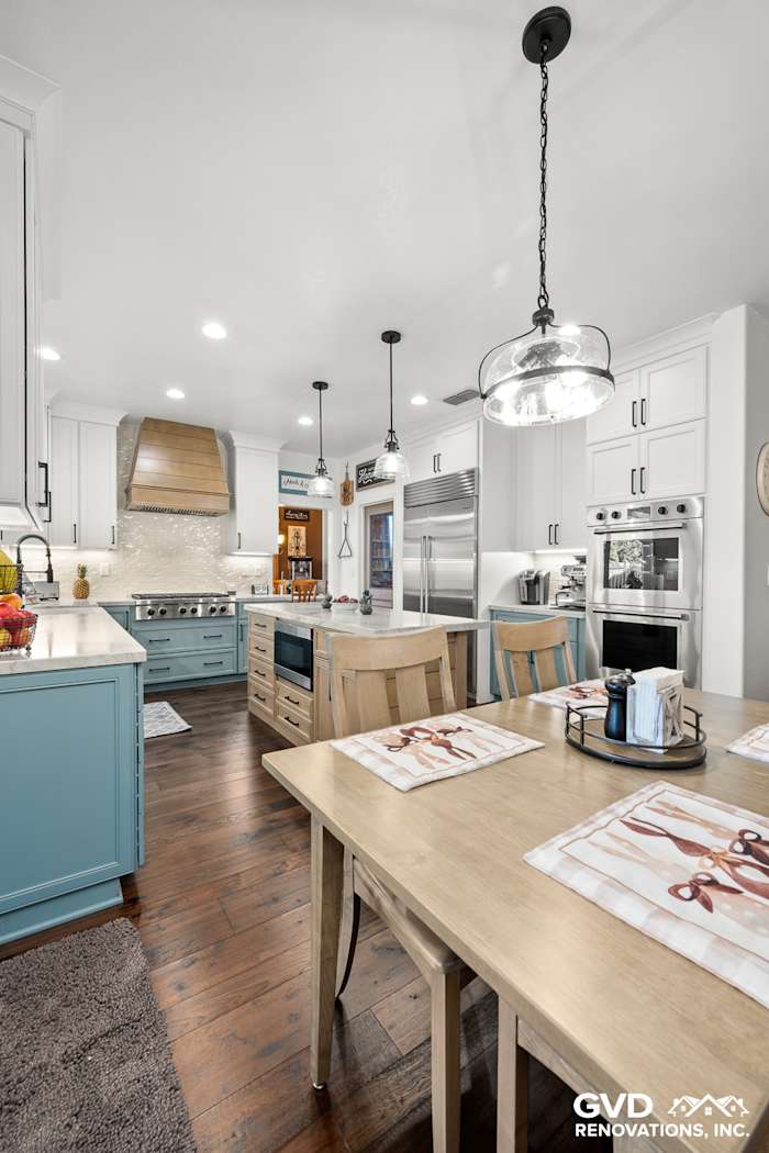 Modern kitchen remodel featuring Fieldstone cabinetry, white quartzite countertops, and a stylish dining area in Roseville