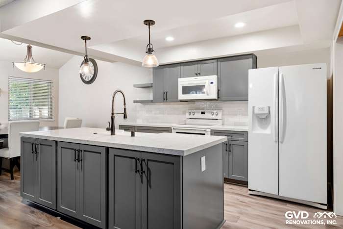 Modern Sacramento kitchen remodel featuring gray cabinetry, quartz countertops, and stainless steel appliances