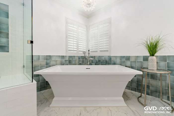 Bright bathroom remodel featuring a soaking tub, green accent tiles, and modern decor in Fair Oaks