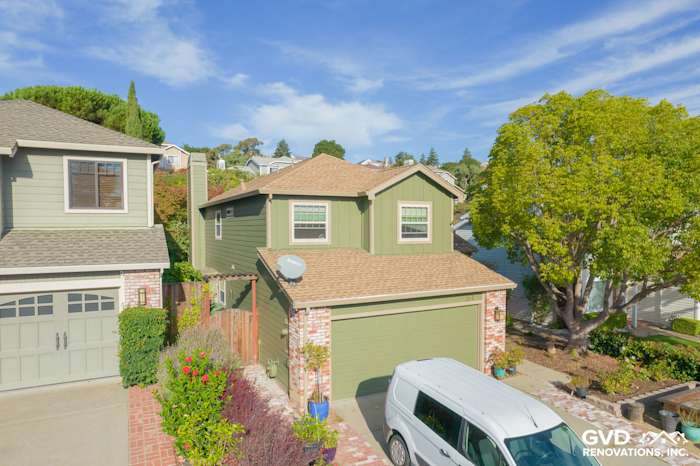 Home exterior showcasing James Hardie siding in Mountain Sage color, new roof, and landscaped driveway in Vallejo, CA