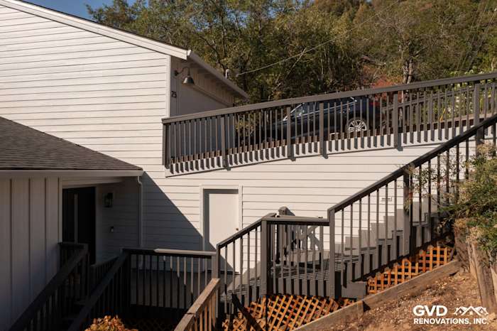 New Arctic White James Hardie lap and vertical siding on a home exterior in Novato, featuring updated railings and stairs