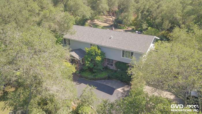 Granite Bay home with Light Mist James Hardie siding and Arctic White trim surrounded by trees