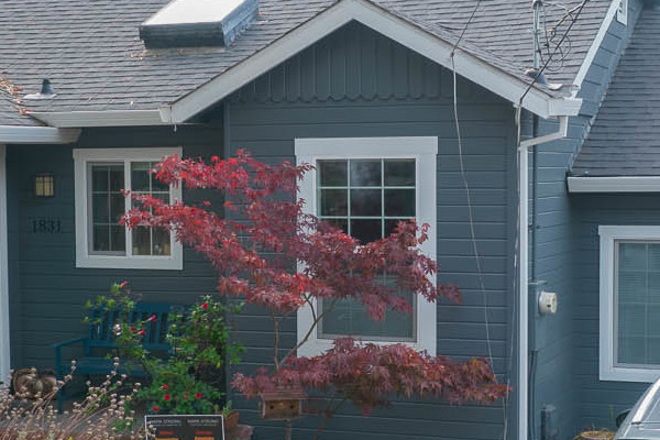 Stylish Napa home showcasing new James Hardie Lap siding in dark gray and teal accents