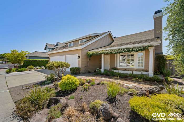 Foster City home featuring Khaki Brown James Hardie siding, Arctic White trim, and landscaped front yard